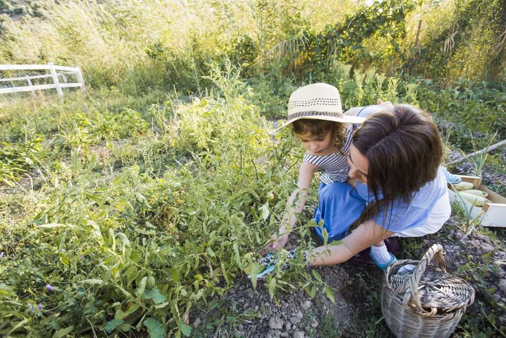 mother and child in natural garden e1567281986702